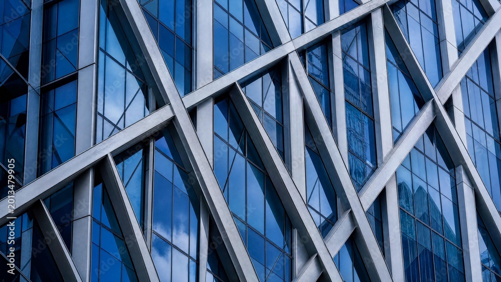 Obraz premium Modern Abstract Architectural Facade with Blue Glass and Steel Geometric Framework