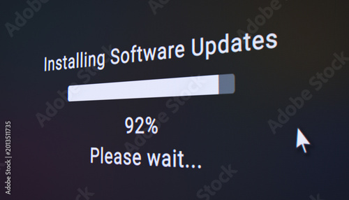 Photography Illustration of a fictitious website with a black screen showing a progress bar for installing system update