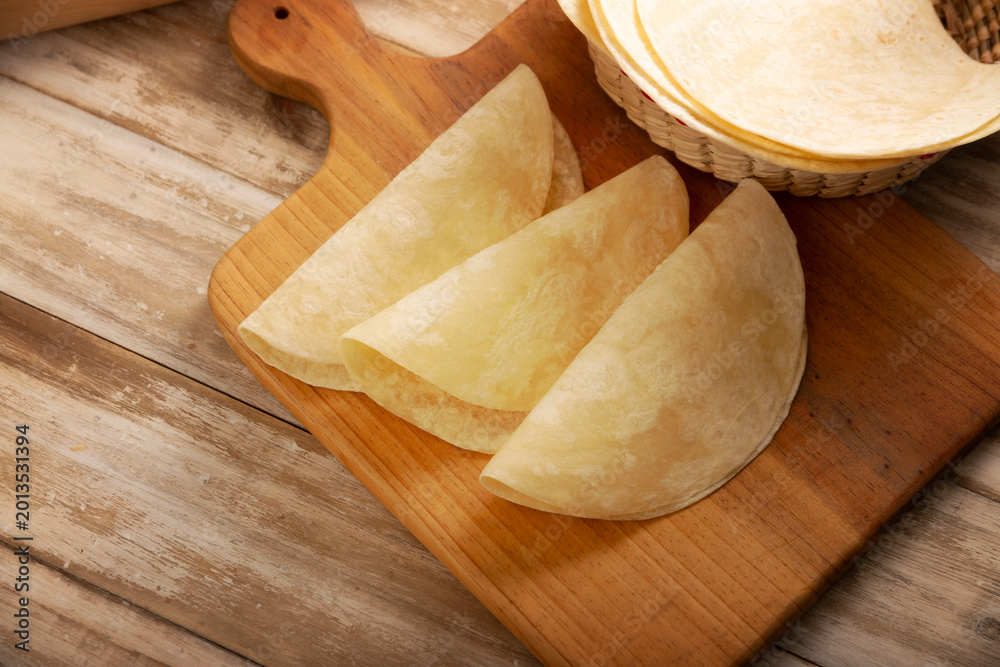 Ταπετσαρία Flour Tortillas, called Tortillas de Harina, is a flat bread made with wheat flour and lard or butter, without yeast, and widely consumed daily in Mexico, especially in the north of the country