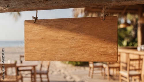 Empty Wooden Sign at a Beach Resort: A blank wooden sign hangs invitingly, ready for a personalized message, against the backdrop of a serene beach resort. Ideal for branding.