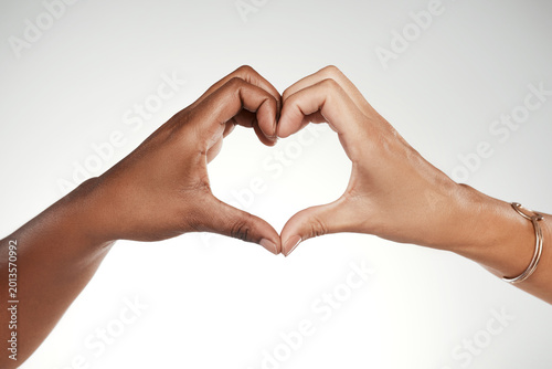 Foto Heart hands, support and partner with people in studio for connection, thank you and respect