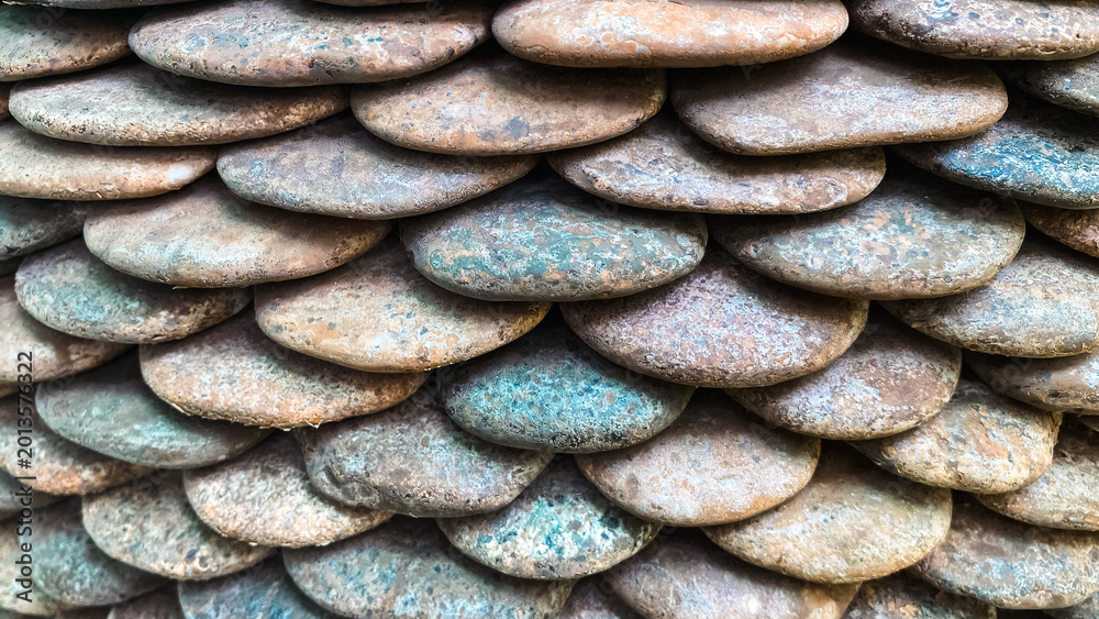 Fototapeta premium Textured Arrangement of Smooth River Stones in Natural Colors