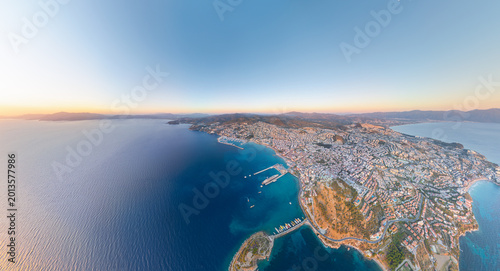 Bild auf Leinwand Kusadasi, Turkey - July 4, 2025: Aerial view of bay with Pigeon Island, yacht marina, port, beaches, promenade, and Mount Kese
