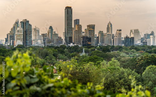 Photography Panoramic cityscape of Bangkok business district overlooking Lumphini Park during golden hour
