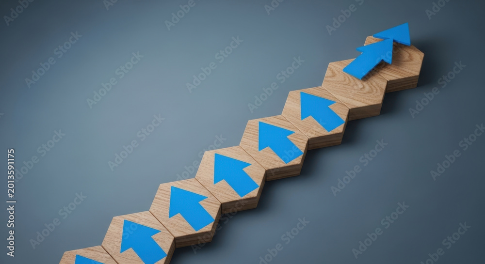 Fototapeta premium Business Growth Step Progression Ascending Blue Arrows on Wooden Hexagons Improvement Development Upward Trend Advancement Direction Progress