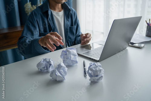 Businessman no idea how to create new project Crumpling Paper in Office