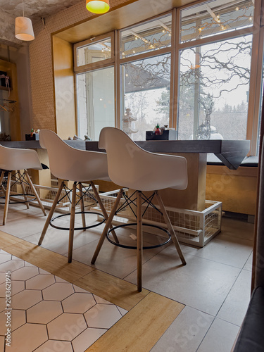 Modern Cafe Interior Featuring Sleek Design, Minimalist Decor, and Inviting Atmosphere for Cozy Gatherings or Productive Work Sessions