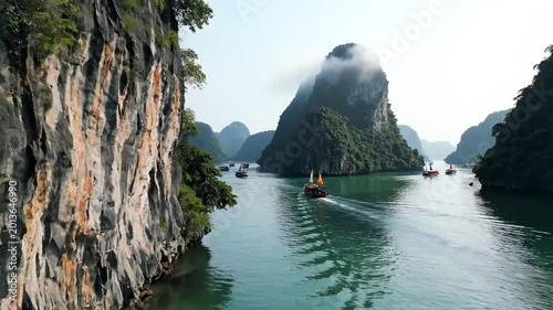 Cruise boats sailing through limestone islands in Ha Long Bay