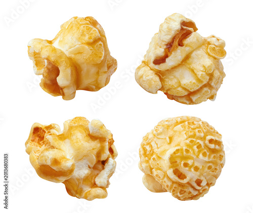 Set of delicious popcorn kernels, isolated on black background
