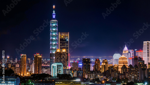 Taipei 101 Skyscraper and Modern City Skyline at Night with Illuminated Buildings