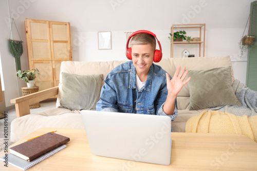 Young woman in headphones w...