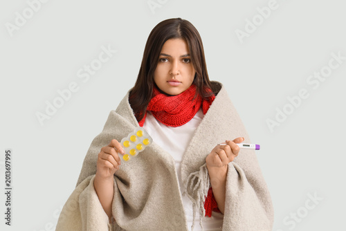 Ill young woman with throat...