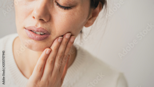 Photos Young woman suffering from toothache