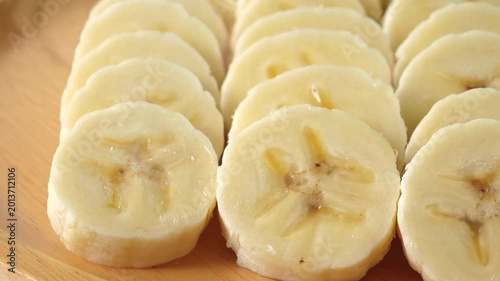 close-up captures the creamy allure of sliced bananas. Each uniform piece unveils a soft	