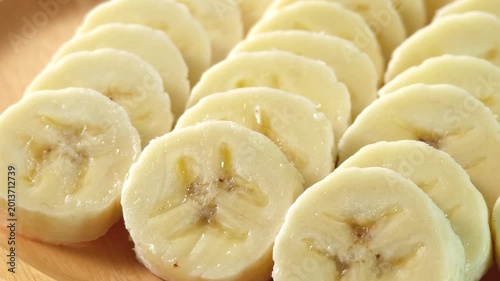 close-up captures the creamy allure of sliced bananas. Each uniform piece unveils a soft	