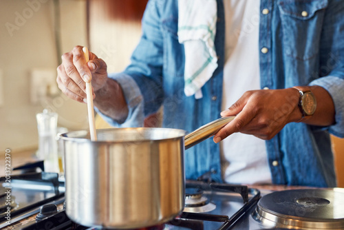 Fotografía Hands, person and cooking with pot in kitchen, lunch preparation and healthy food in home