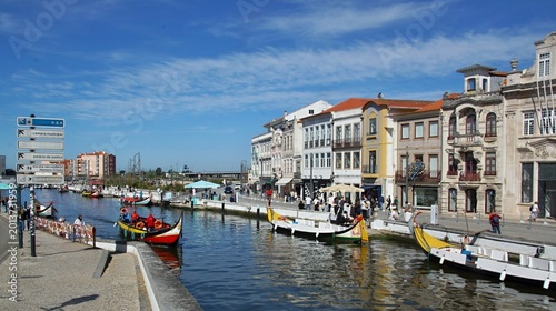 Aveiro Portugal moliceiro boats navigating city canals. Aveiro - Portugal