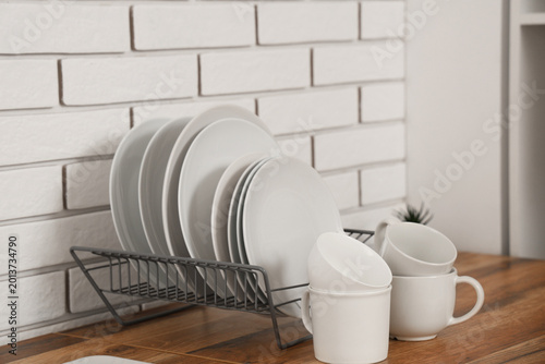 Rack with clean plates and ...