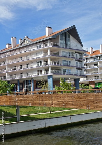Modern apartment building along a canal with bridge. Aveiro - Portugal