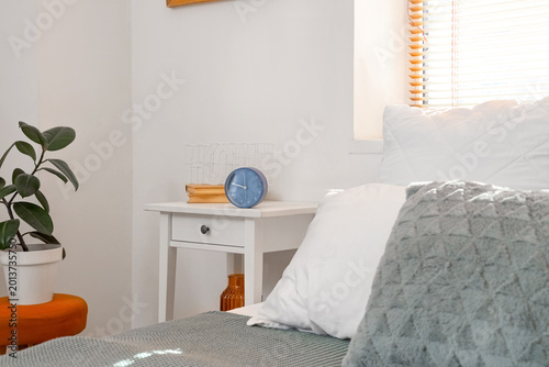 Alarm clock with books on t...