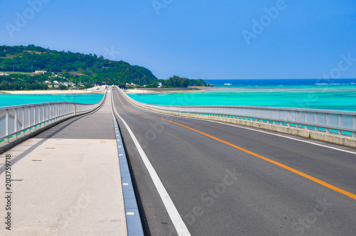Driving on Kouri Bridge toward the emerald green sea, Okinawa, Japan (High resolution)