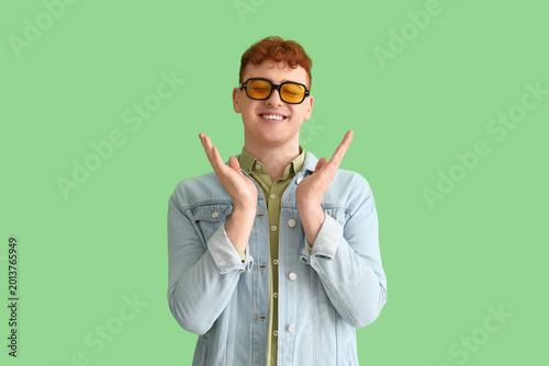 Young redhead man in sungla...
