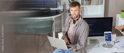 Young bearded programmer wo...