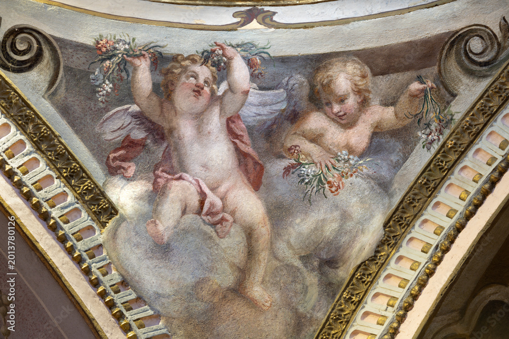 Naklejka premium CREMA, ITALY - MARCH 20, 2026: The fresco of angels with the flowers the church Santuario di Santa Maria della Croce by Giacomo Parravicino - il Gianolo (1702).