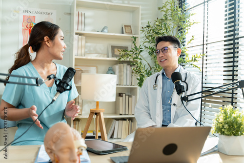 Cuadro en lienzo Professional Asian doctor and assistant hosting a live medical podcast and health vlog, discussing medicine and wellness with microphones