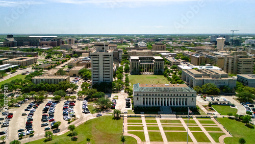 Bild auf Leinwand Aerial view of green campus lawn office buildings and parking in College Station