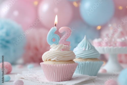 Elegant birthday cupcake with candle celebrating 62nd birthday in pastel colors