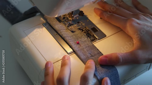 Be captivated by the detailed process of sewing. The video showcases nimble fingers skillfully maneuvering through fabric layers, creating stunning projects with ease and passion!