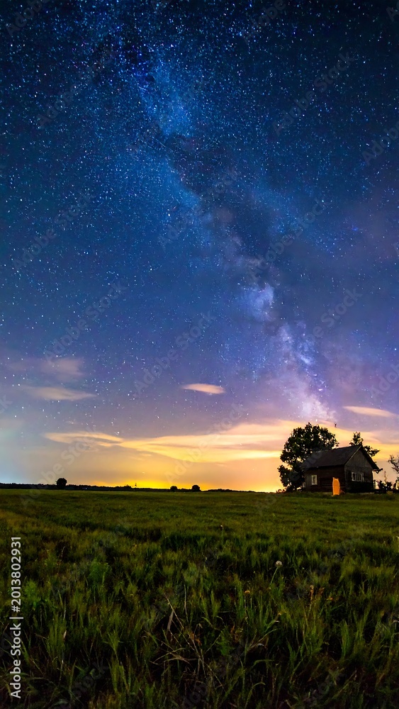 Fototapeta premium Milky Way over rural landscape scene.