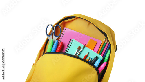 Cuadro en lienzo Isolated vibrant yellow open backpack filled with diverse school and art supplie