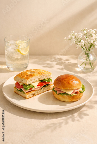 Sunny Brunch Plate with Focaccia Sandwich, Brioche Sandwich, Lemon Soda and White Flowers