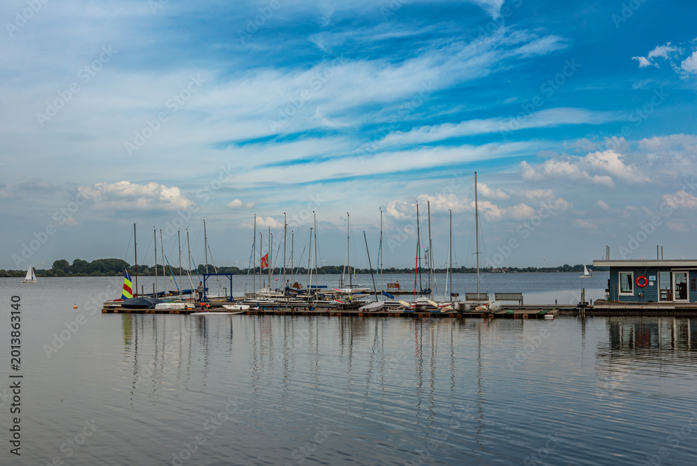 Fototapeta premium Boats in Olgahafen on Lake Dümmer, Lower Saxony, Germany