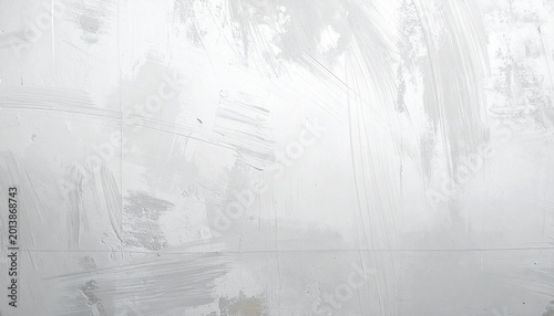 White textured wall with visible brush strokes.