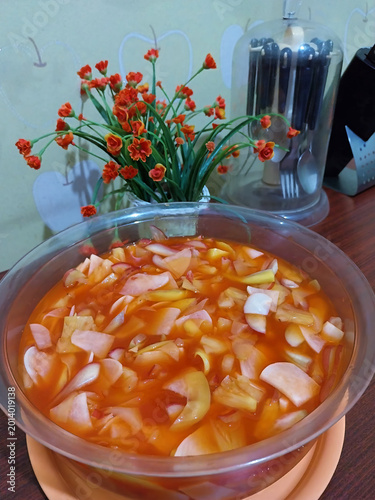 Fotografija Traditional Indonesian fruit salad, Asinan Bogor, served in a bowl with a spicy,