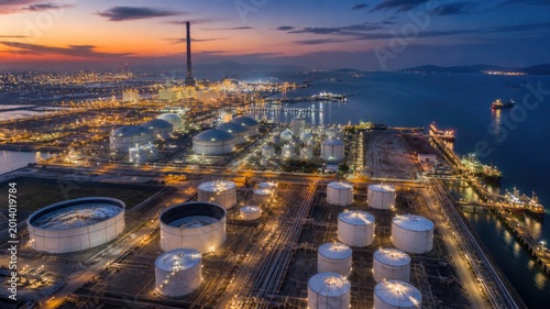 Aerial View of Oil Refinery and Industrial Port at Night with Energy Storage and Maritime Infrastructure