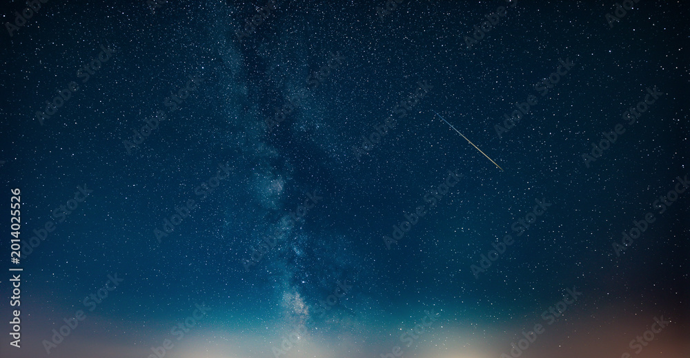 Fototapeta premium Constellations and Milky Way stars on a dark countryside skies.
