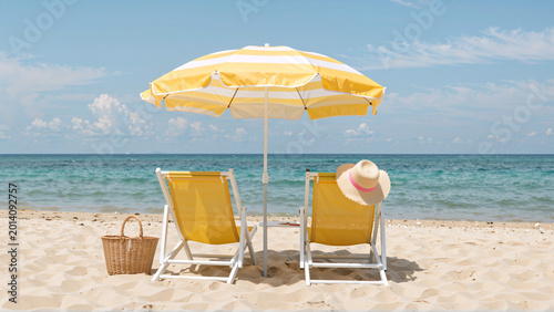 Beach chairs and umbrella on a sandy beach