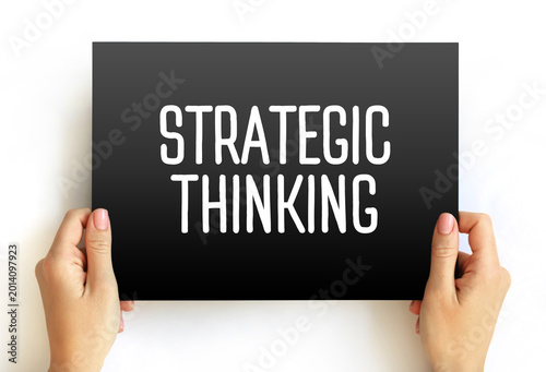 STRATEGIC THINKING message held by hands. Concept of planning, problem-solving, and leadership. Ideal for business education, management training, and brainpower visuals.