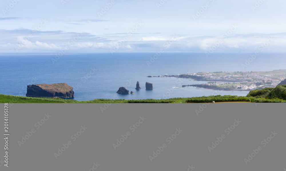 Fototapeta premium Mosteiros, San Miguel Island, Azores, Portugal. Green fields and farmland along the coast. Scenic view of the Atlantic Ocean and rock formations.