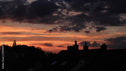 Dramatic Red Sunset Over German Town Skyline