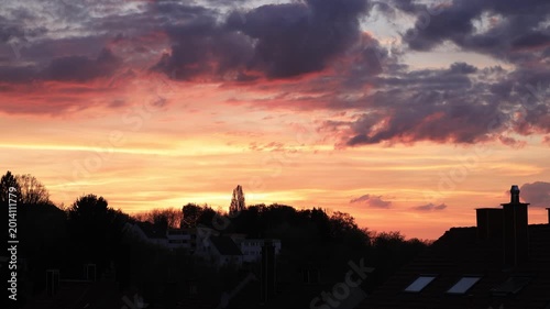 Dramatic Red Sunset Over German Town Skyline