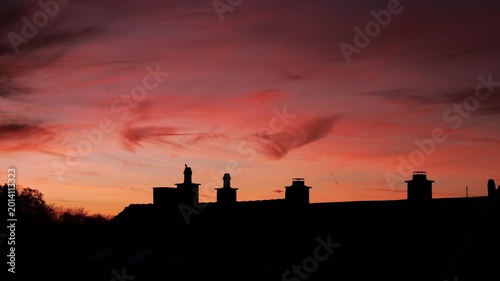 Dramatic Red Sunset Over German Town Skyline