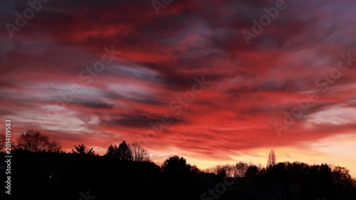 Dramatic Red Sunset Over German Town Skyline