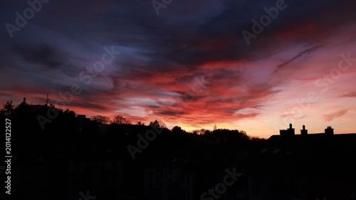 Dramatic Red Sunset Over German Town Skyline