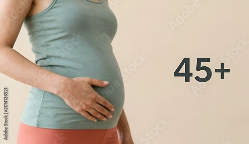 Pregnant woman holding belly with 45 plus text for late pregnancy concept
