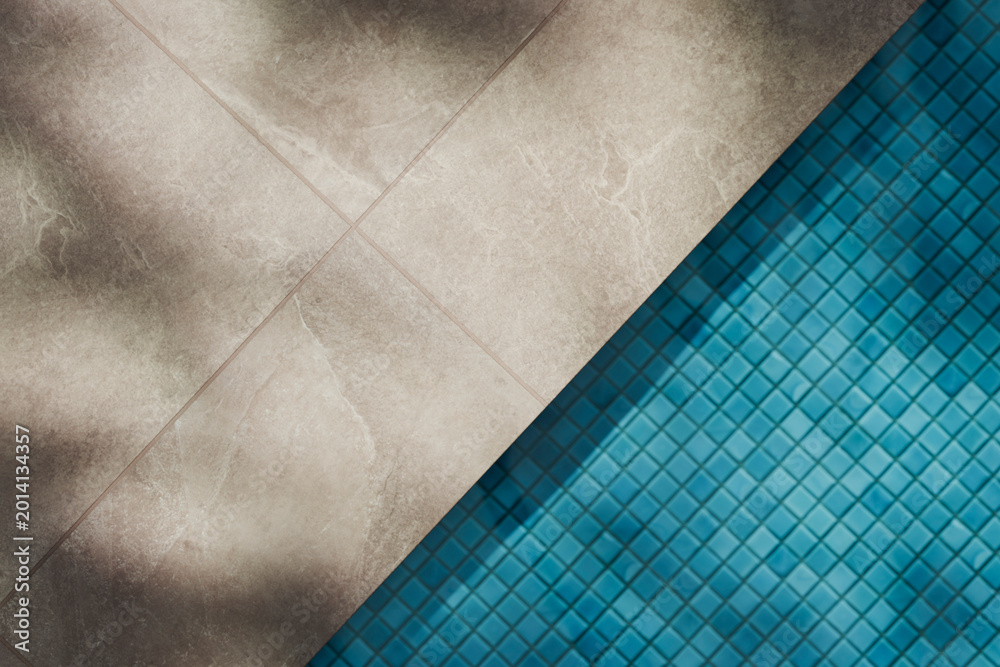 Fototapeta premium Luxury swimming pool with granite tiles and shadow light mockup template. Tropical summer background. Poolside aesthetic product placement. Minimal pool design for modern brand display